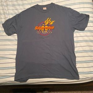 Blue tint Supreme shirt.